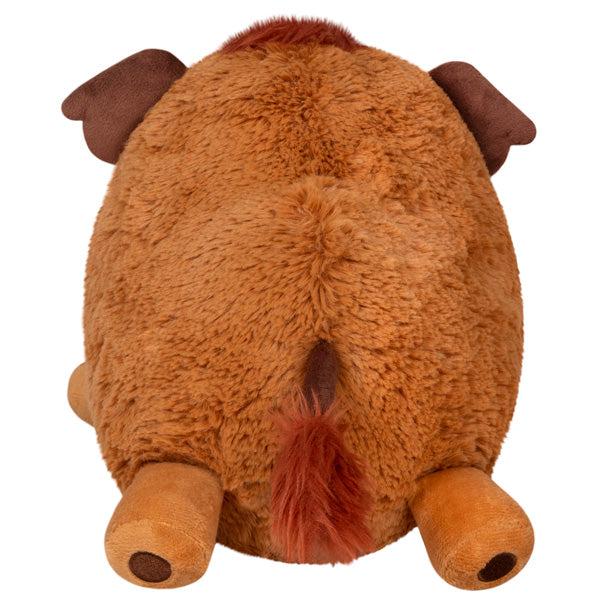 Back view of the plush. Shows that there is a matching darker red tuft of fur at the end of its tail.