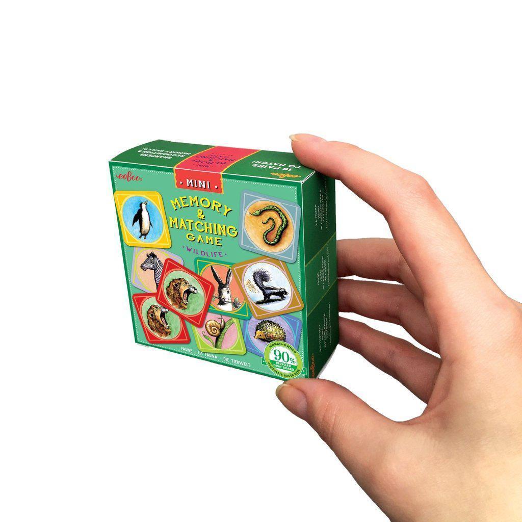 a close look at the wildlife memory and matching game, the box easily fits into a hand, with images of a penguin, lion, rabbit and more to metch