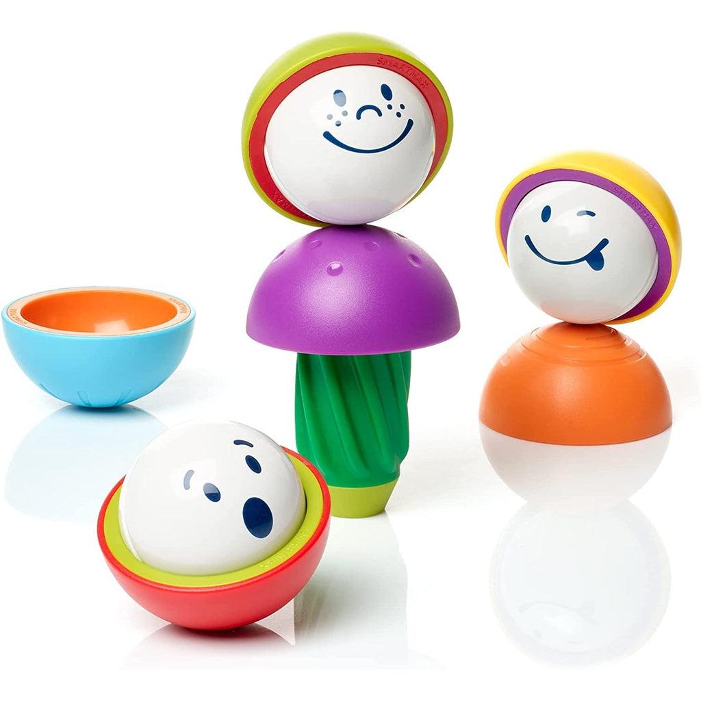 Toys out of packaging | Spheres with phases and bowl shaped pieces are stuck together in a variety of combinations.