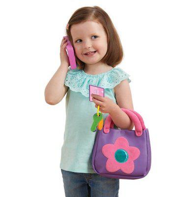 Scene of a little girl smiling while using her purse to carry her things while she takes a phone call.