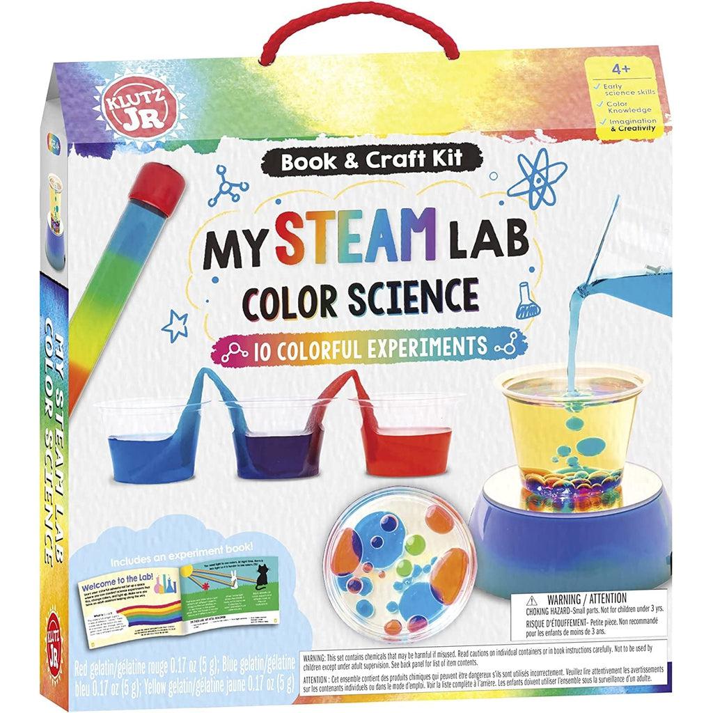 Toy in packaging | Front of box depicts experiments described in contents against a white background. | Top of box is rainbow with an easy-carry handle.