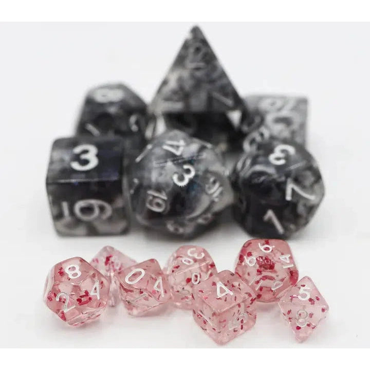 The halfling dice are shown next to a normal sized set of plastic dice. They are somewhere between a third the size and half the size.