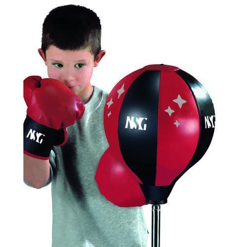 this image shows a child wearing boxing gloves ready to box the target ball.