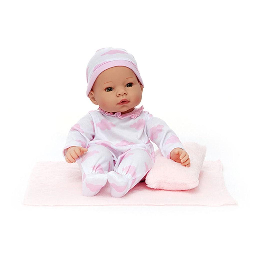 A plastic baby doll is shown wearing a white onesie and a hat with pink clouds printed on it.
