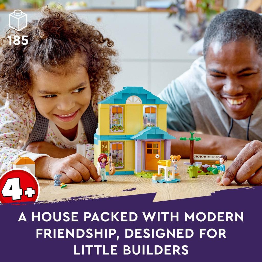 a girl and her father are shown playing with the lego set | piece count of 185 in top left | age recommendation of 4+ in bottom left | Image reads: A house packed with modern friendship, designed for little builders.