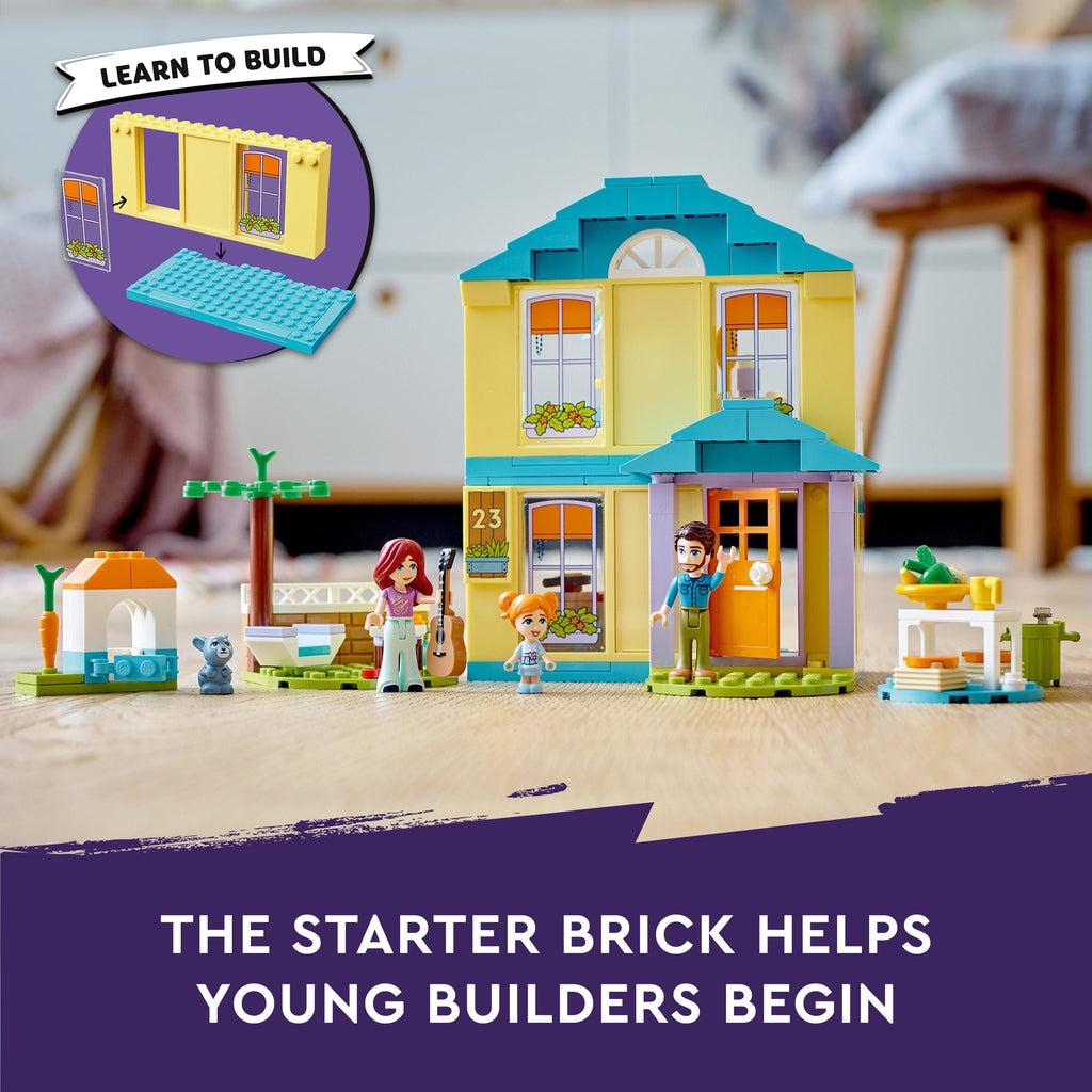 Image shows the play set on a floor | graphic in top left shows large starter brick and reads: Learn to build | bottom of image reads: The starter brick helps young builders begin.