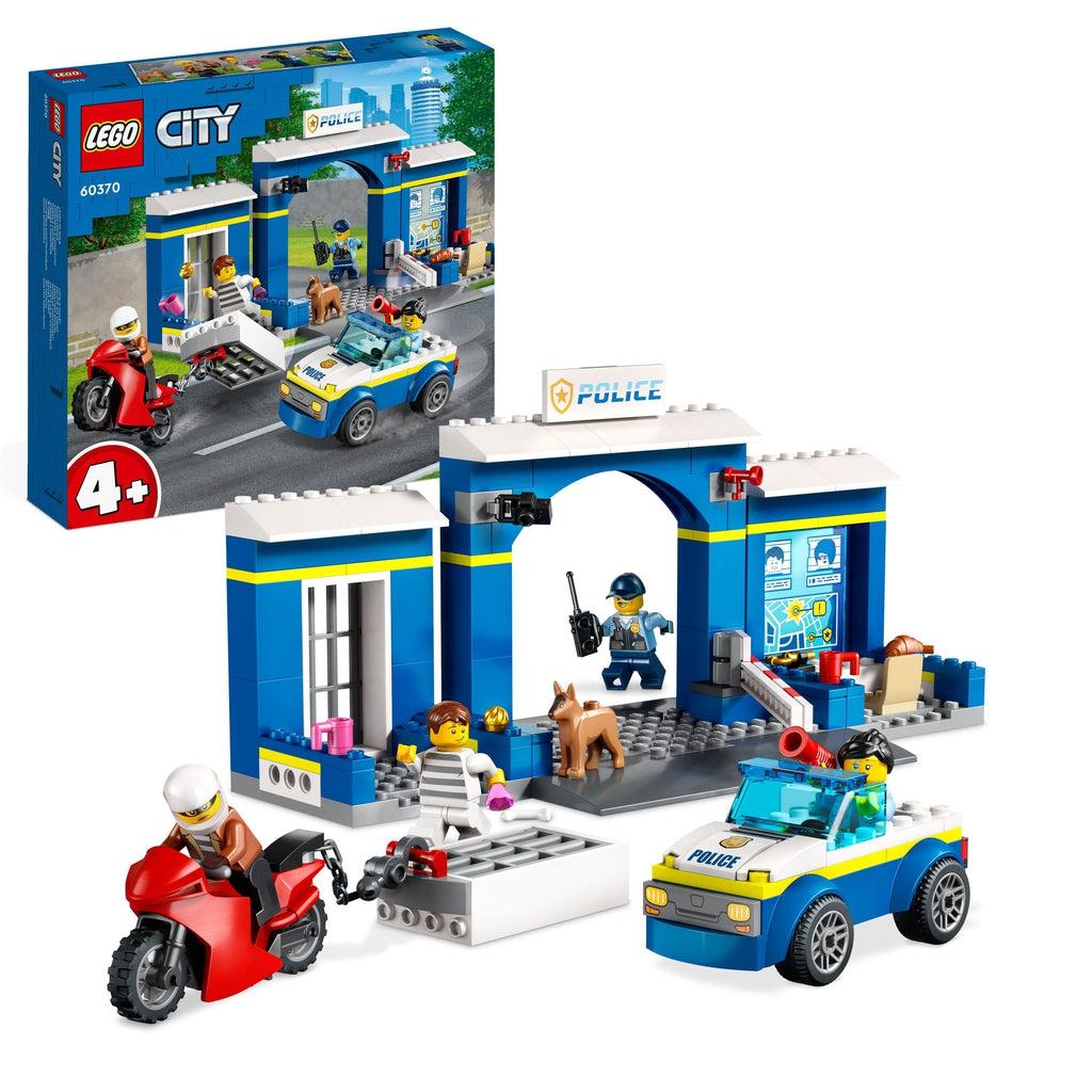 Image shows the lego set in front of the box | There is the front of a jail with a cage on one side, a car with a policewoman figure in a lego car, a policeman figure, two crook figures, and a lego dog figure