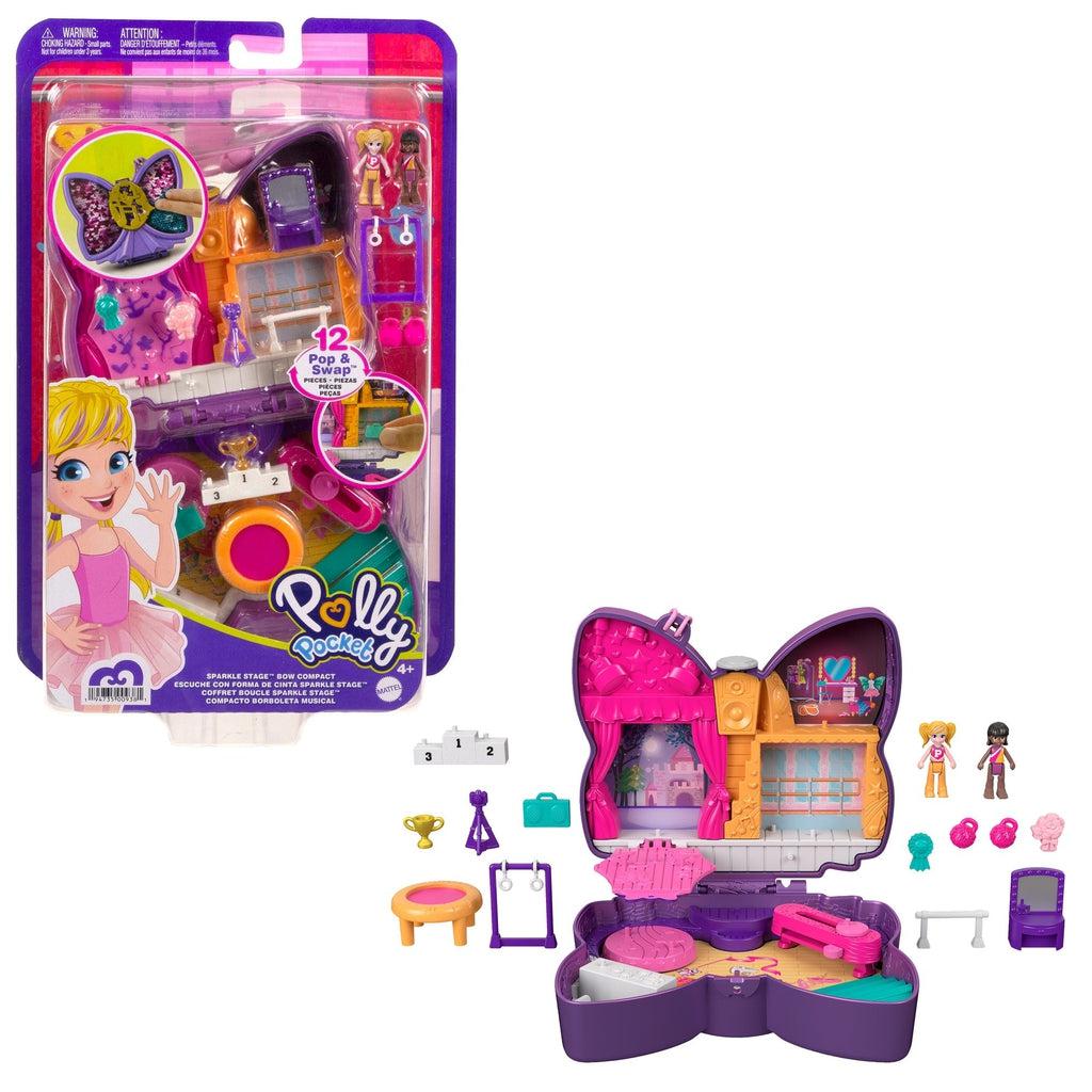 Image of the packaging for the Polly Pocket Sparkle Bow Compact. The front is clear so you can see the included pieces inside.