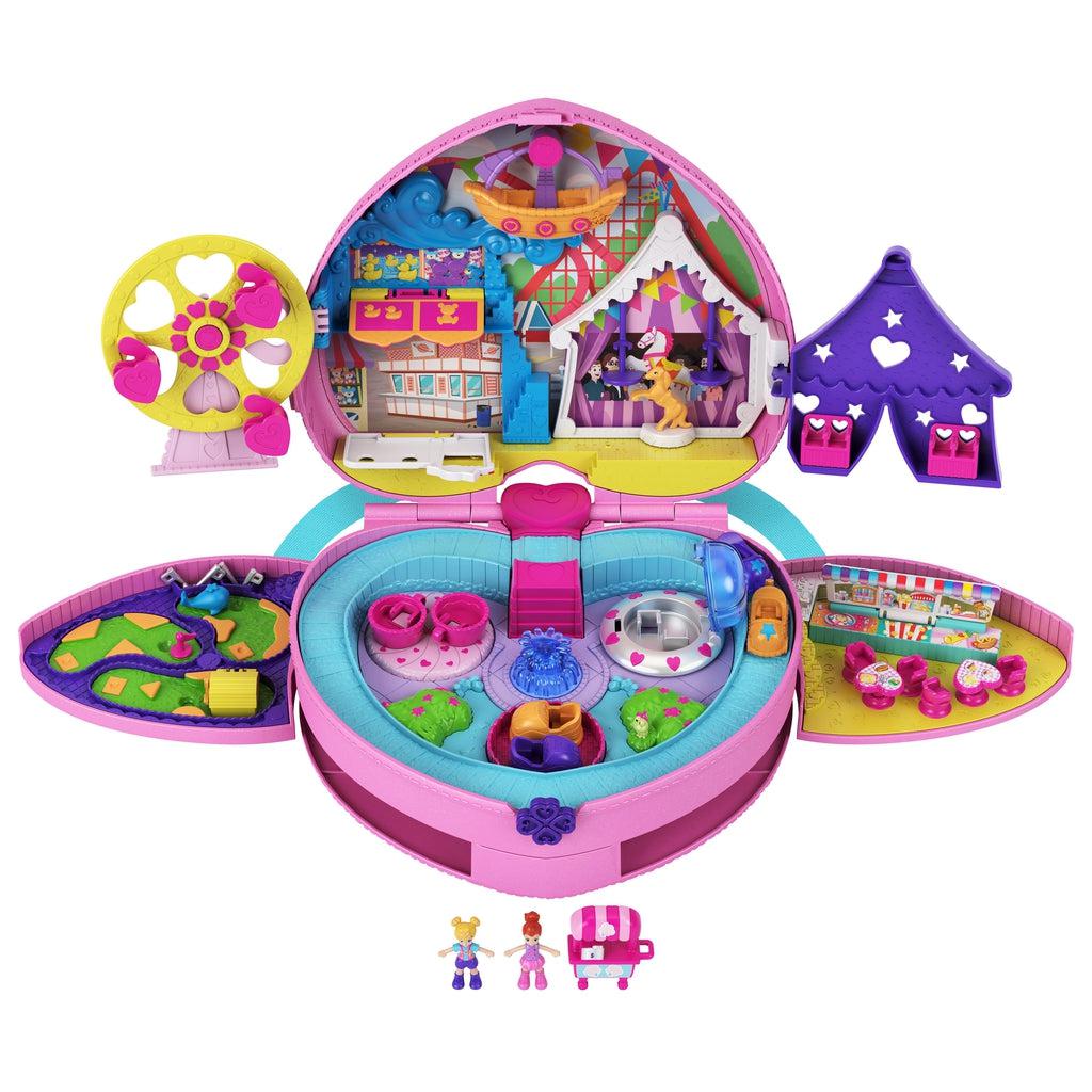 Backpack fully open | Top section composed of Ferris wheel, mermaid photo-op, carousel, pirate ship ride, and circus tent. | Bottom section is composed of: Mini golf course, rollercoaster, spinning rides, and dining court. | Polly and Lila micro dolls and popcorn cart included.