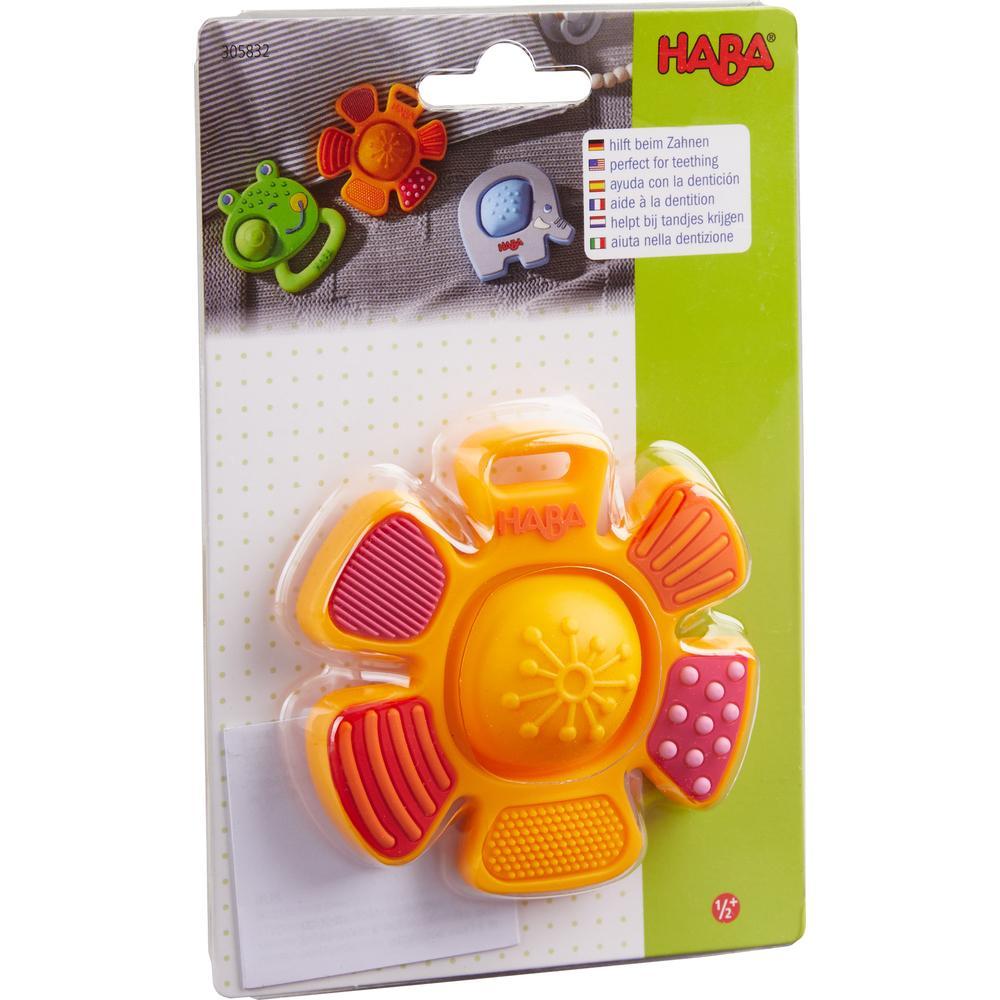 Image of the packaging for the Popping Flower Teether toy. Part of the front is made from clear plastic so you can see the toy inside.