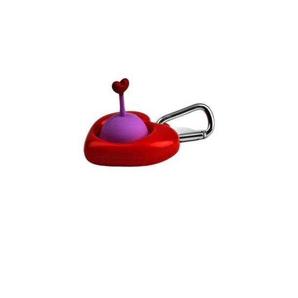The pull n' pop is a heart shaped piece of plastic with a hole in the middle and a keychain attached to the back. The inside of the heart shape contains a rubber bubble with a antenna puller with heart on the end for use when popping and pulling this fidget toy.