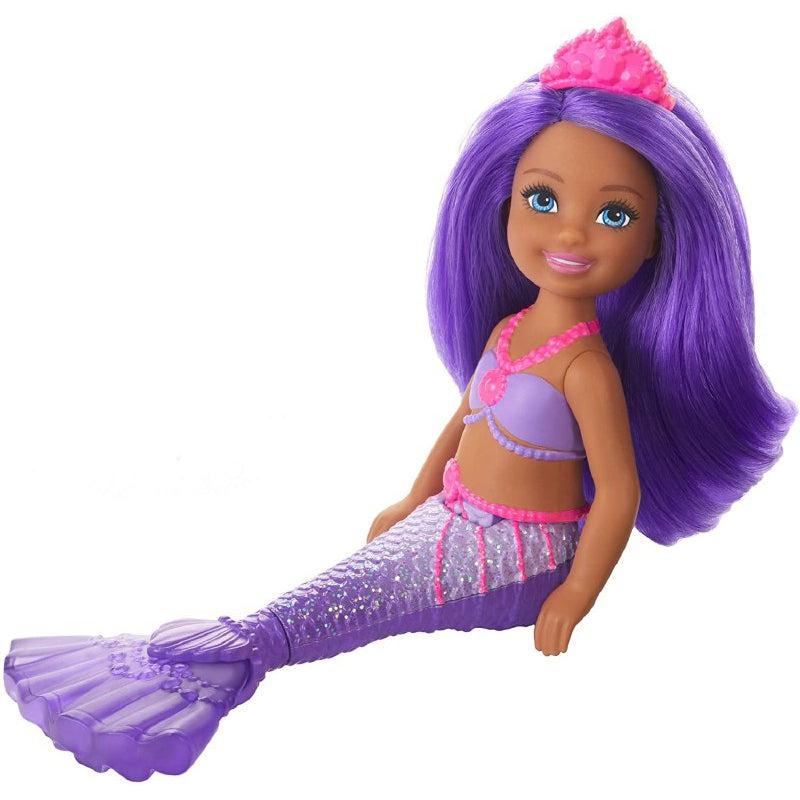 The chelsea doll has long purple hair down to the waist. It has a pink tiara, a purple top and a purple mermaid tail. The doll also has a pink necklace and beads on the waist.