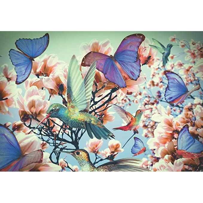 Puzzle image | Multiple hummingbirds and purple & blue butterflies float amidst pink magnolia blooms against a blue sky.