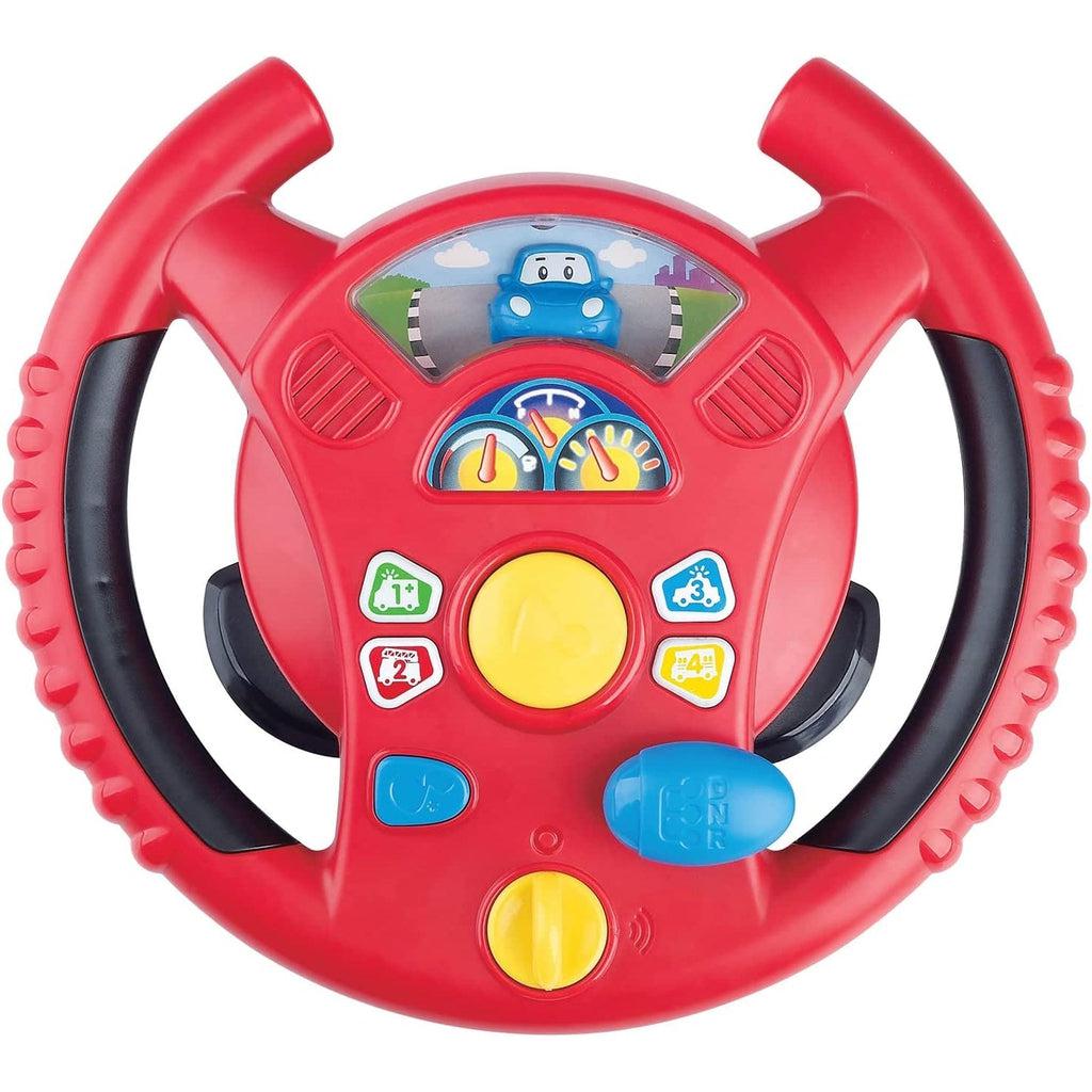 Image of the steering wheel outside of the packaging. It is red with a picture of a blue car on top. It has many different buttons and knobs that make different sounds.