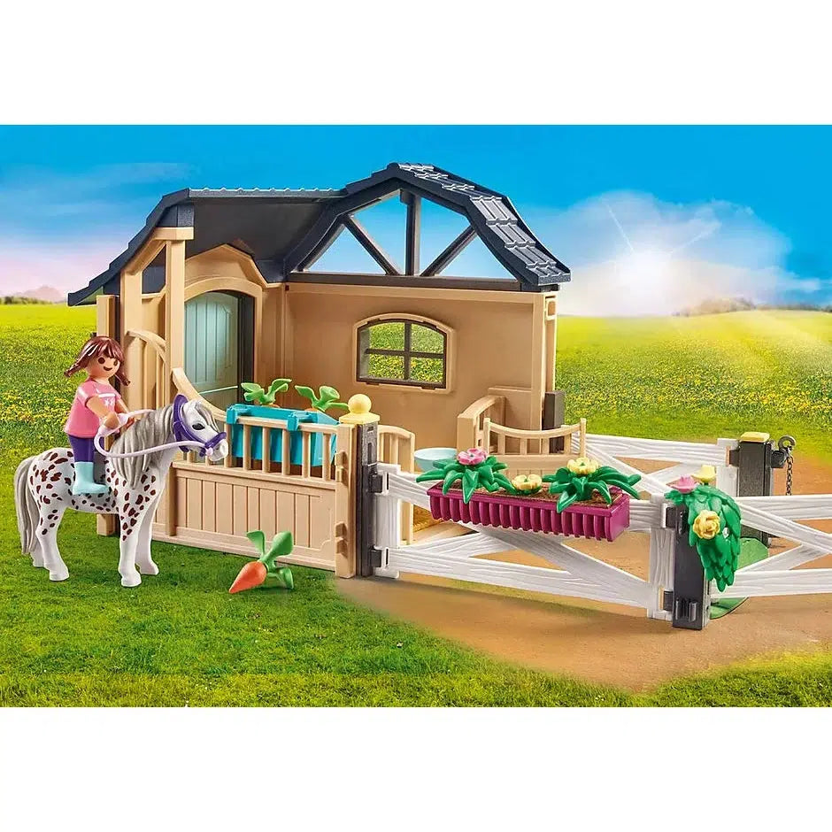 The image from the box is shown again. The stable extension building is a half building with a fence gate at one end for horse entry