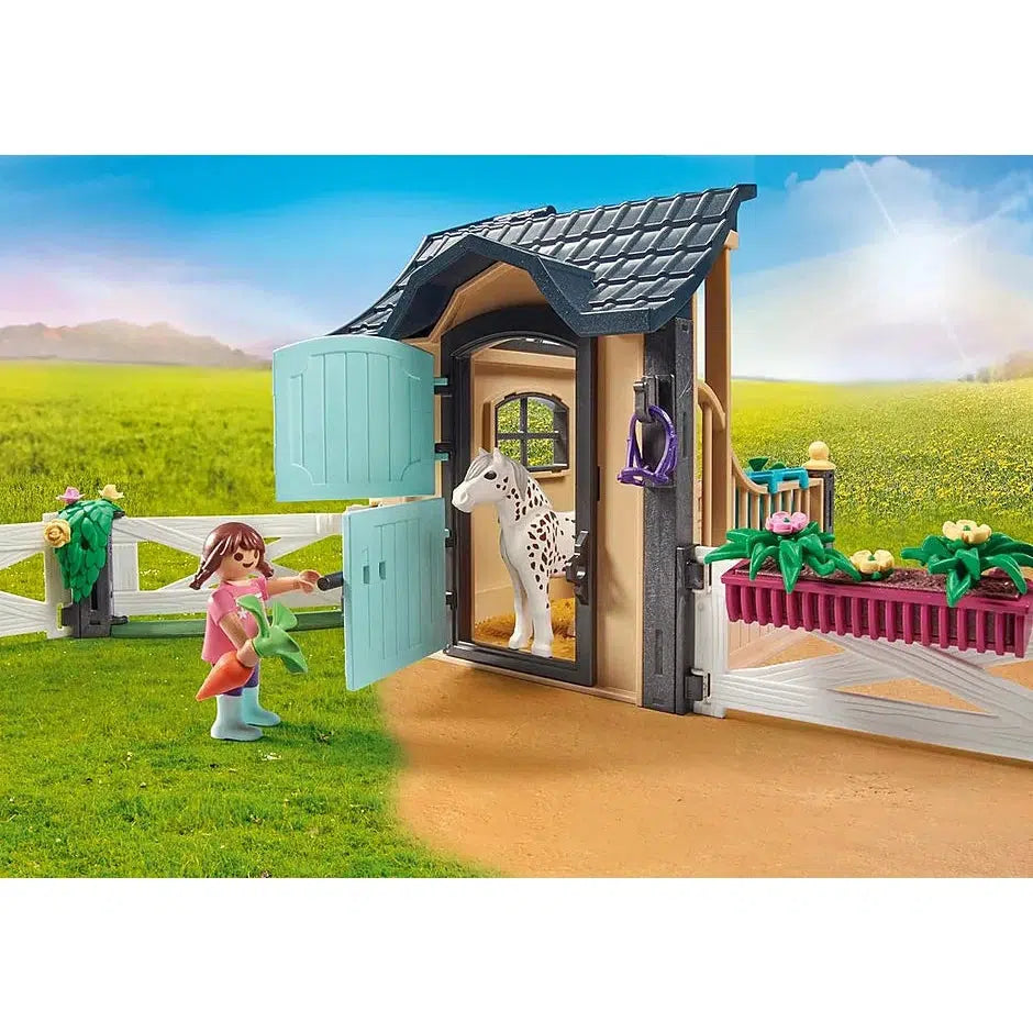 The girl figure lures the horse through the stable door into the fenced area with a carrot