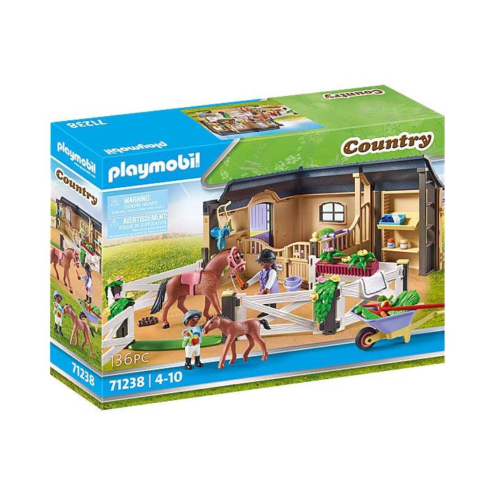 The front of the box shows the 2 figures, 2 horses, paddock, and stable half building