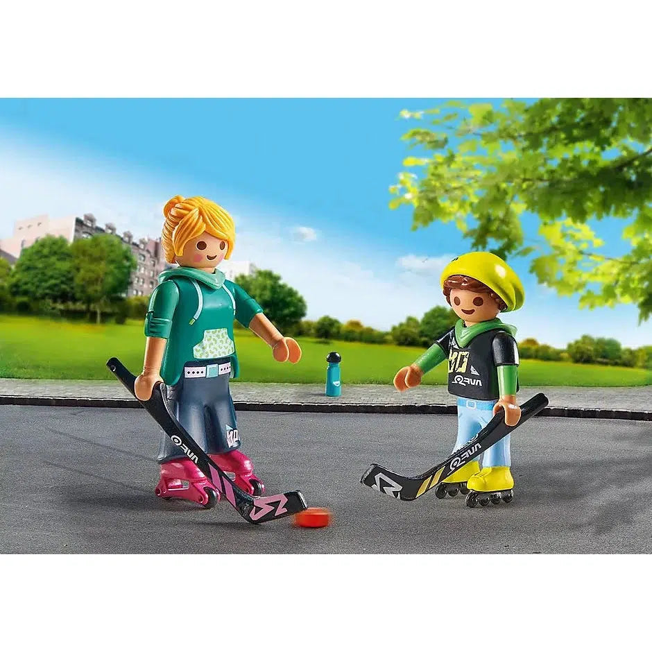The two figures are out of the packaging and standing on their skates and holding hockey sticks