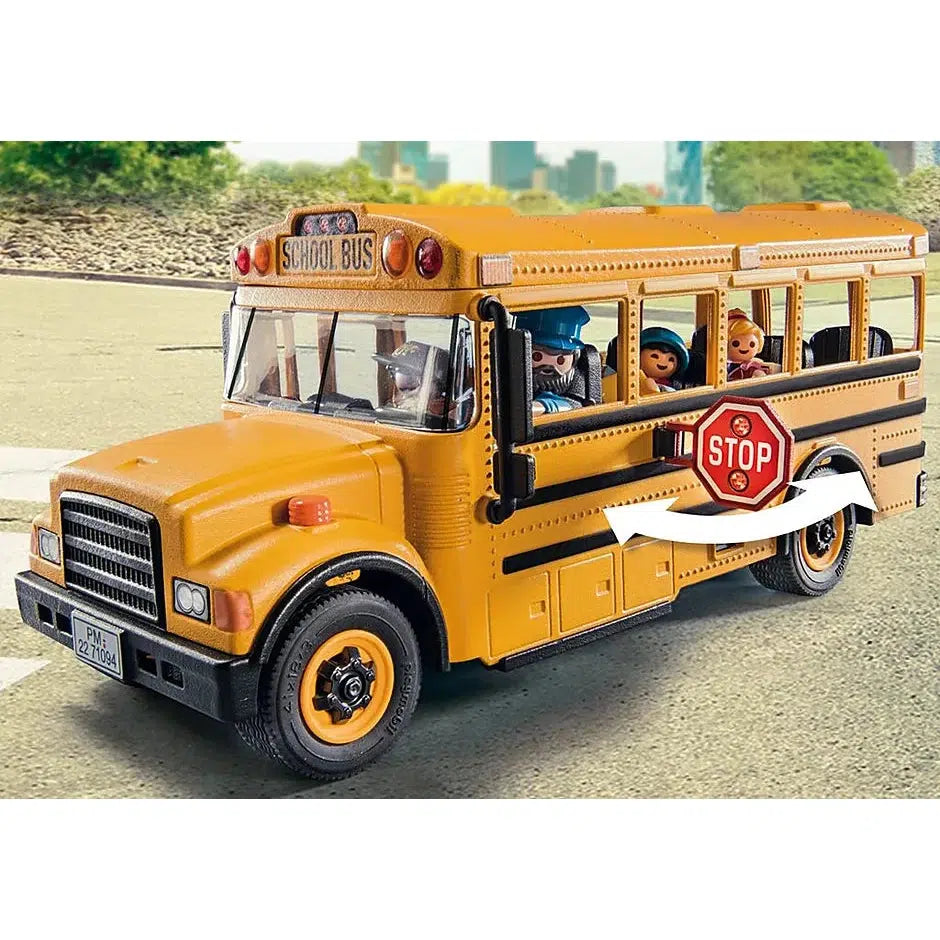 The school bus is shown from the left side, There is a stop sign that clips to the side and can be pushed flat or extended like a real bus