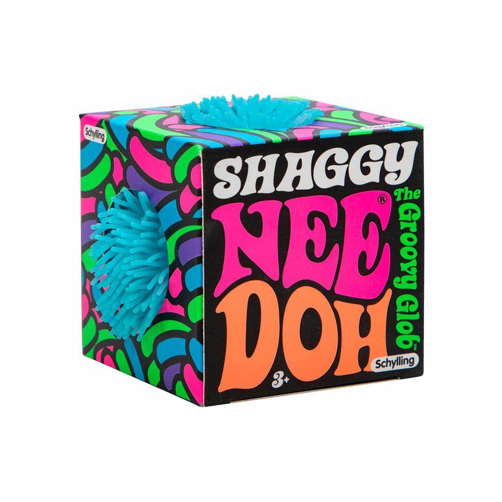 Packaging is covered in psychedelic colored shag with holes showing the needoh on the top and sides. The name of it is printed on one side