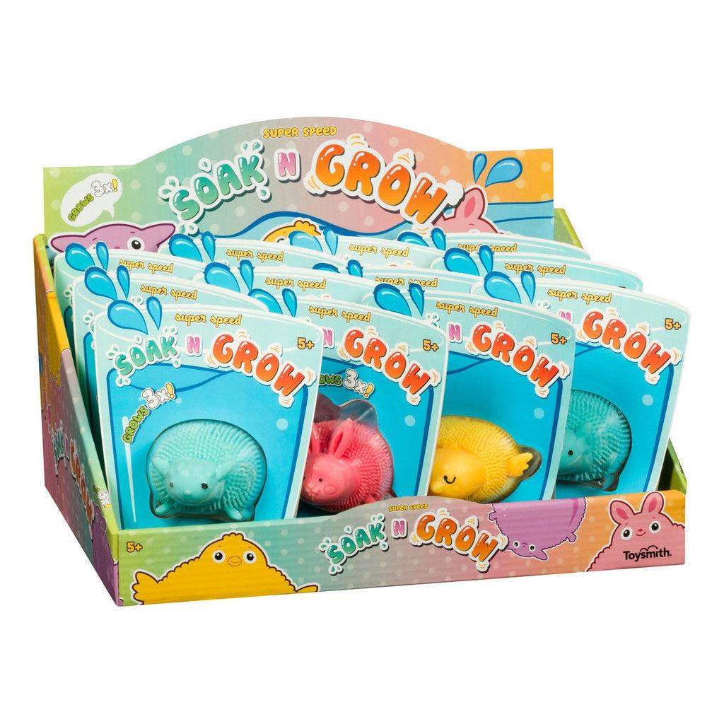 A display box full of blister packaged items reads: super speed Soak n' Grow. The different versions consist of a lamb, a rabbit, and baby chick.