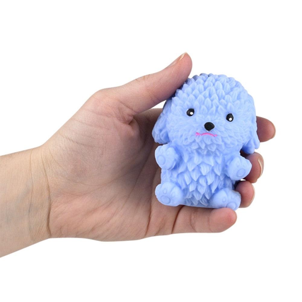 Image of the blue poodle being held to show size. About the size of an adult palm.