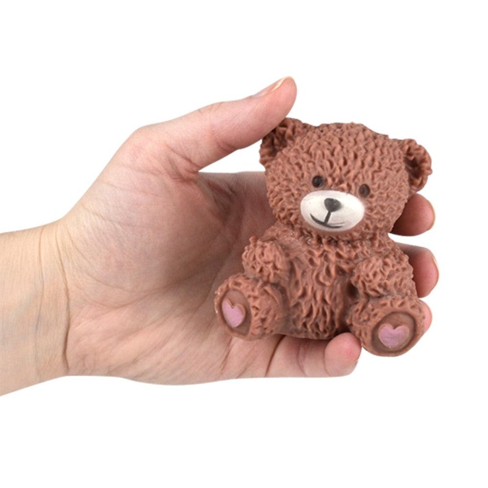 Shows the brown variation of the toy being held to show size. It is about the size of an adult palm.