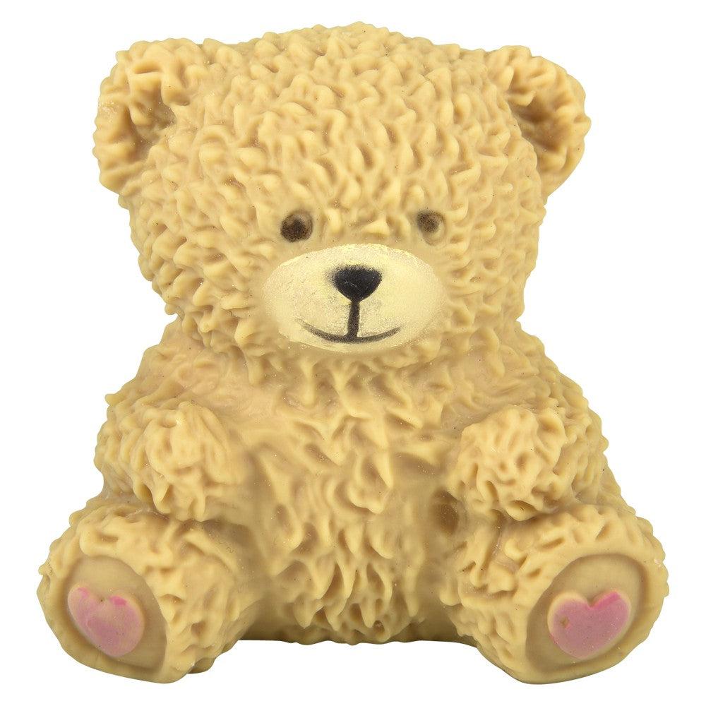 Image of a Squeeze & Stretch Teddy Bear toy (tan version). It has lots of detailing for the fur. It has brown eyes and pink hearts on the bottoms of its feet.