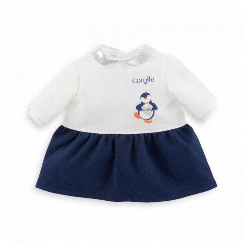 The dress consists of two halves. A white long sleeved shirt with a penguin holding a heart on it attached to a navy blue dress skirt