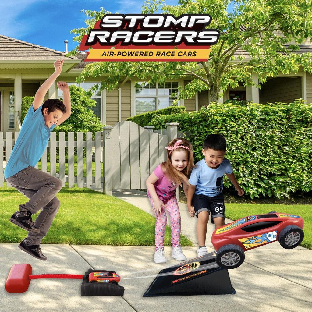 A boy is shown in the air jumping on the stomp pad to launch the car. There is also an enlarged version of the car shown driving off a ramp with wind trails leading back to the smaller car in the launcher, implying that it was launched from there.
