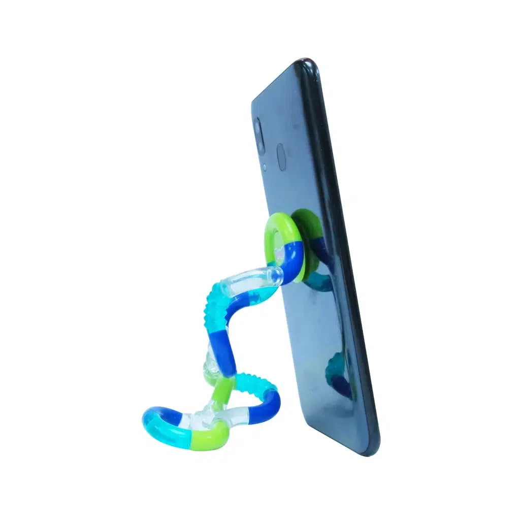 The tangle is shown functioning as a stand for a phone to hold it up.