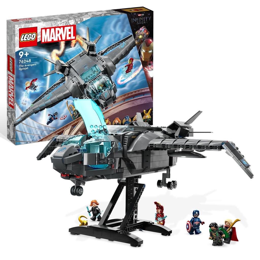The lego set is displayed in front of its box | There are 5 lego minifigures and a lego quinjet from the avengers movies on a lego display stand.