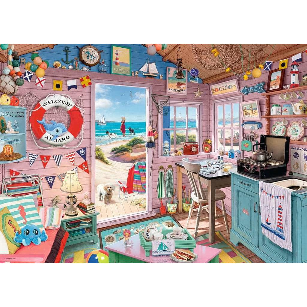 Puzzle image | Interior of a beach house as if the viewer is sitting inside | The walls are covered in beach themed décor | A small couch sits to the left side, an open doorway in the middle, and a small kitchen and table to the right | Through the open doorway a woman and two dogs an be seen looking out over the water. 