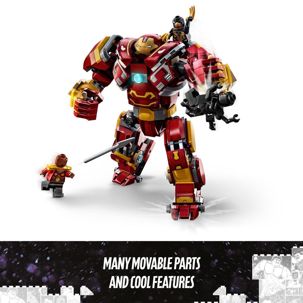 two lego figures are on top of the hulkbuster and a third minifigure throws a spear at one of the first two | Image reads: many movable parts and cool features