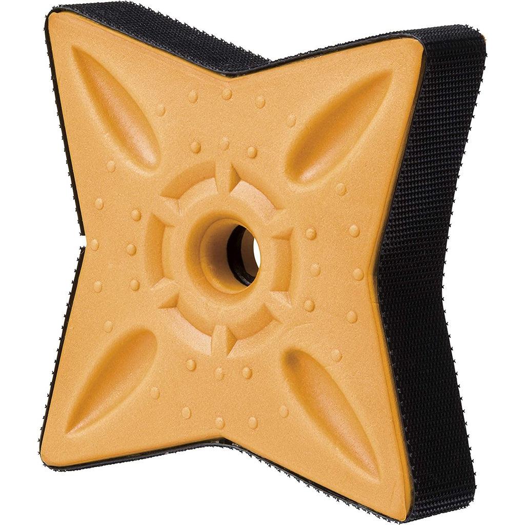 A close up on the ninja star. It's a 4 pointed star with a hole in the center and velcro around the edges so it can stick to the target.