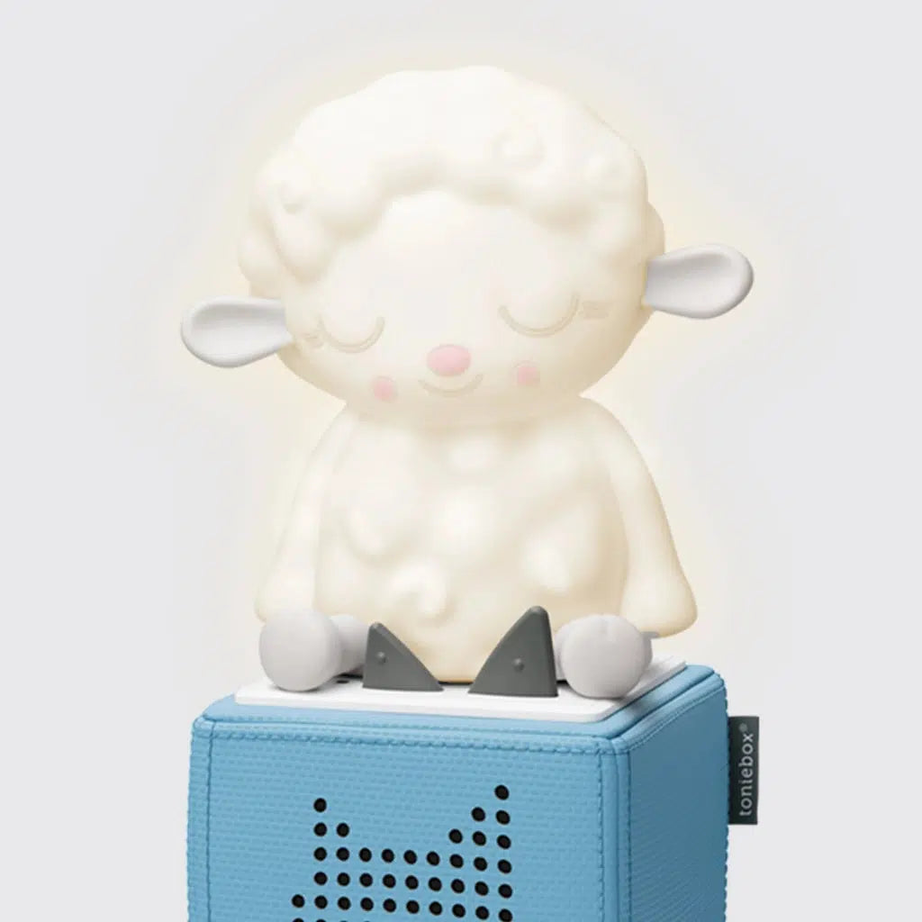 The figure is a fluffy white sheep, about as large as a toniebox, everything but the ears and feet glow with a soft light when the nightlight feature is turned on