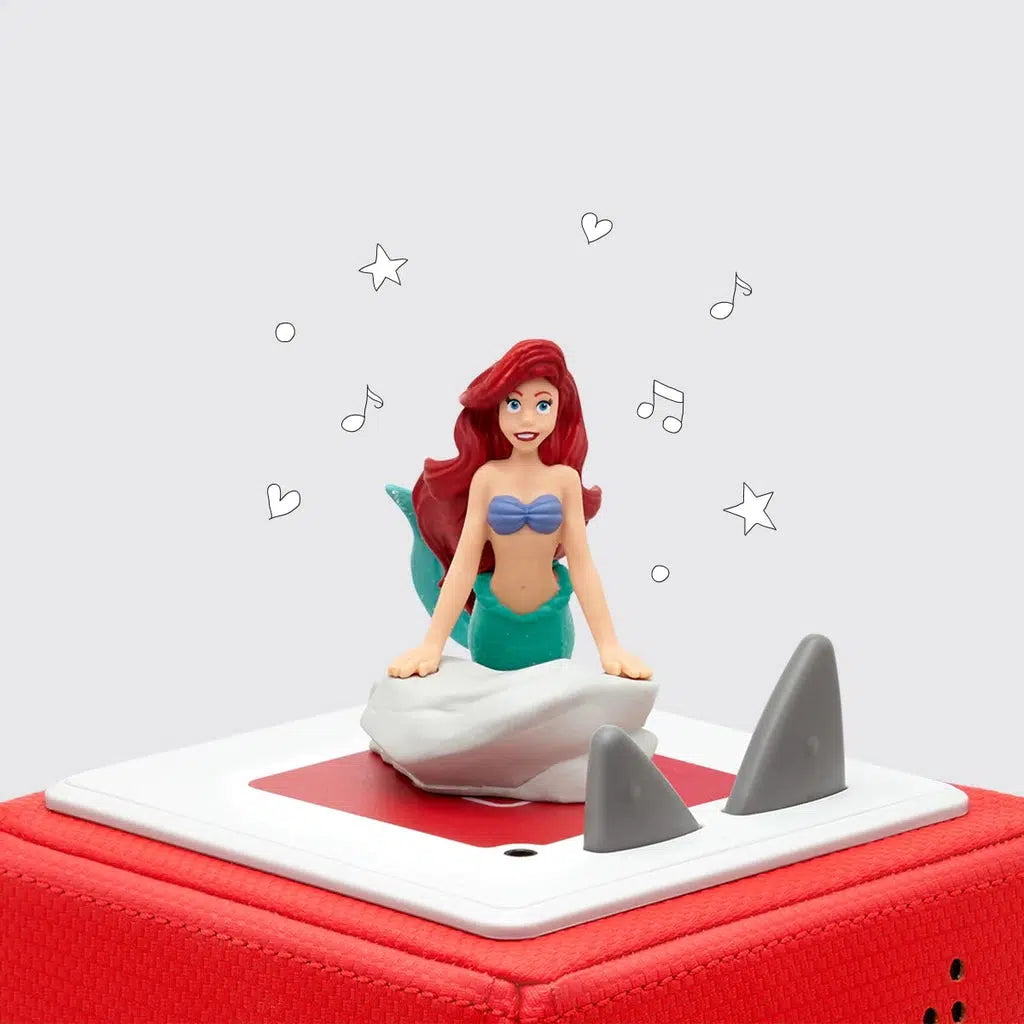 disney The little marmaid as a tonie. she is perched on a rick singing on top of the tonie box