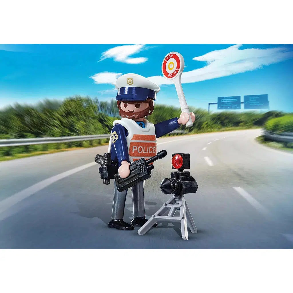 Scene of the Traffic Policeman holding a walky-talky and a handheld stop sign. He also comes with a hat, a gun, and a speed camera.
