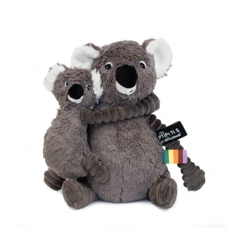 Image of the Trankilou the Koala plush set. It comes with a mom koala and a baby koala. They are both dark grey with some white accents and have large noses. Their arms and legs are made from a different ribbed fabric of the same color.