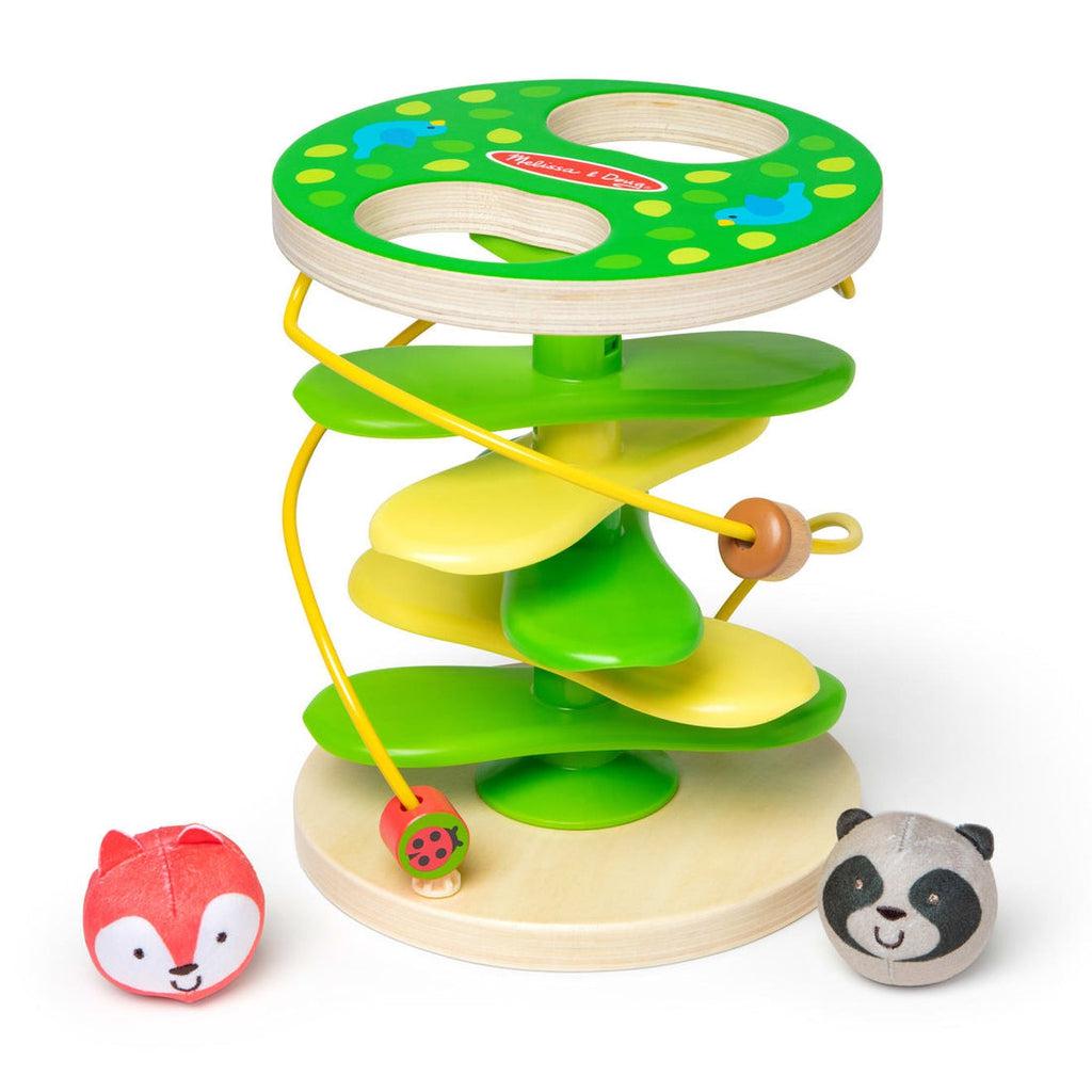 Toy out of packaging | Rollable balls shaped like a fox and anda head | Tiers of rounded fan blades sit between wooden flat pieces | The top wooden piece has two holes for the balls to fall through and down the fans | Two tracks with beads spiral around the outside of the tower