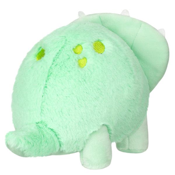 Back view of the plush. You can see that there are a couple yellow-green embroidered spots on the dino's flank.