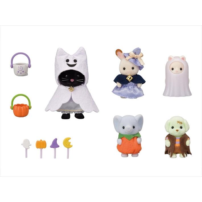 Image of all the included pieces outside of the packaging. It comes with five different characters with unique costumes. It has a cat as a cat ghost, a rabbit as a witch, a smaller cat as a glow-in-the-dark ghost, an elephant as a pumpkin, and a dog as Frankenstein's monster. The set also includes two trick or treat baskets and four Halloween themed wands/candy.