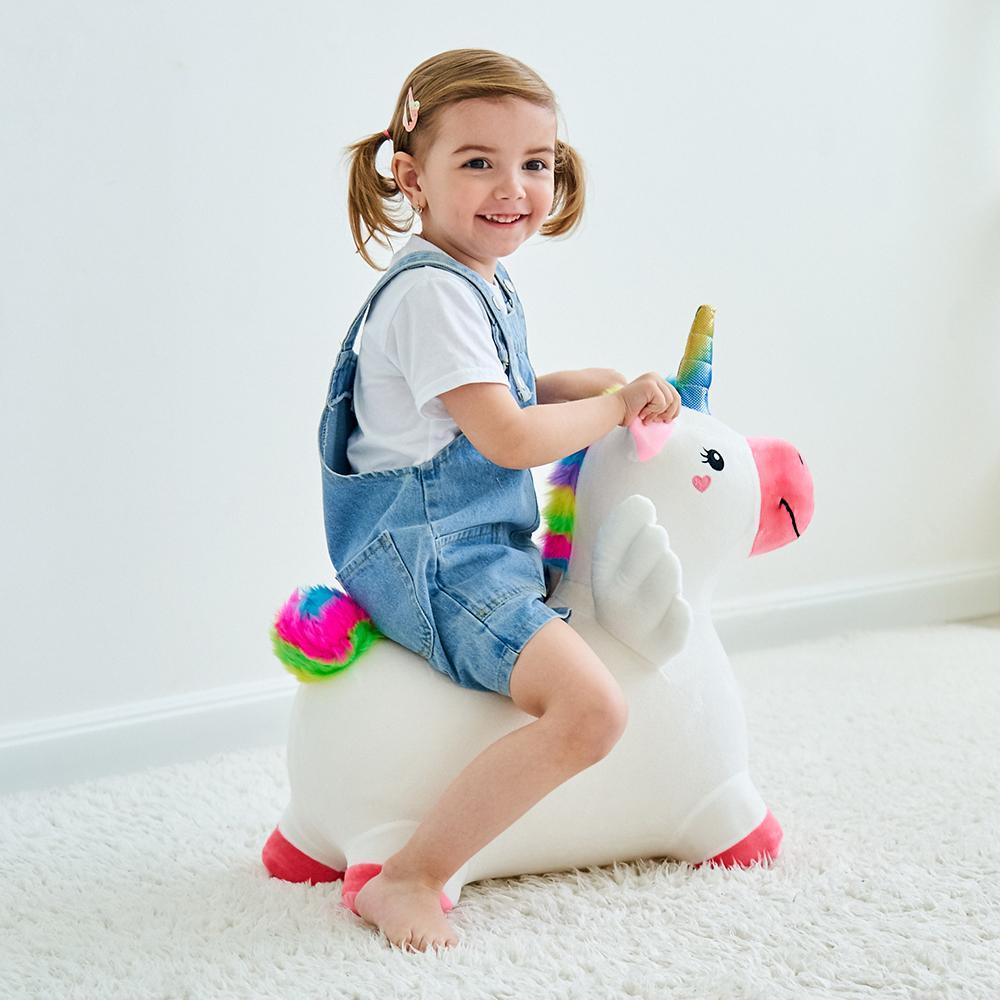 this image shows a toddler playing on the unicorn. it works as both a fun seat and a toy