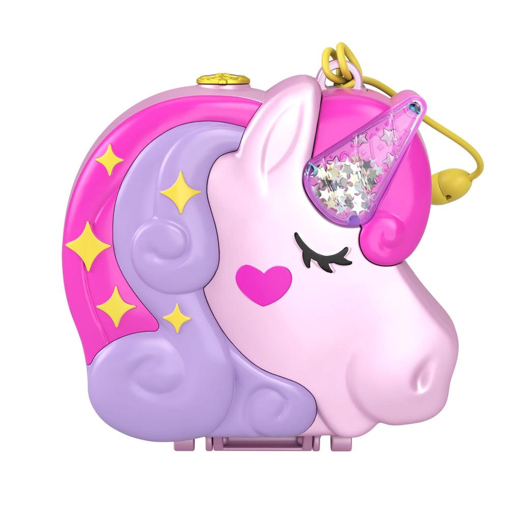 Closed compact | Compact is the shape of a unicorn head with pink and purple hair, a heart on its cheek, and a clear horn with shakable glitter. | Compact has a yellow adjustable strap for travel use.