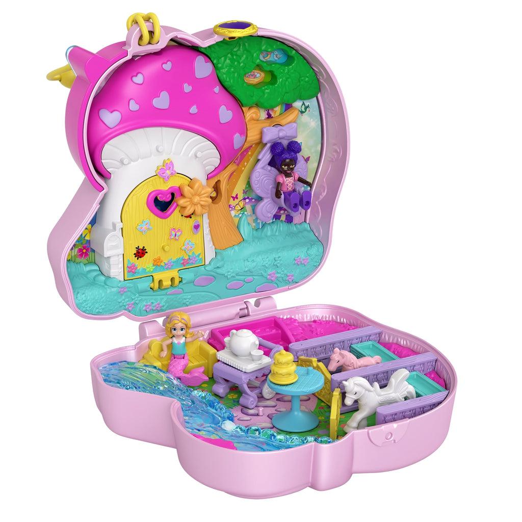 Open compact | Compact interior top half: Pink mushroom house with opening yellow door, and tree with hanging purple butterfly swing. | Bottom half compact: Two horse stalls with opening doors, a sitting area, and river made of blue transparent material