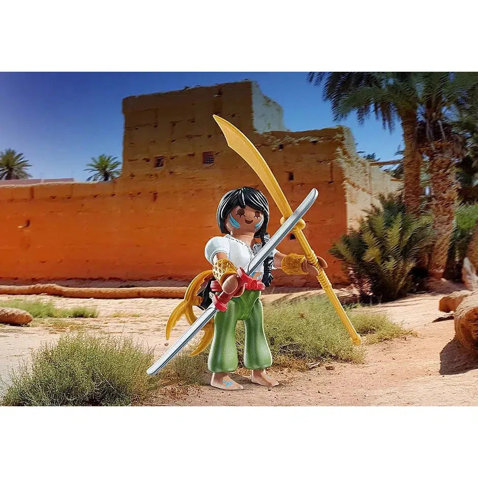 Scene of the Warrior holding her weapons, a golden spear and a double sided sword. She is wearing a white shirt and green poofy pants.