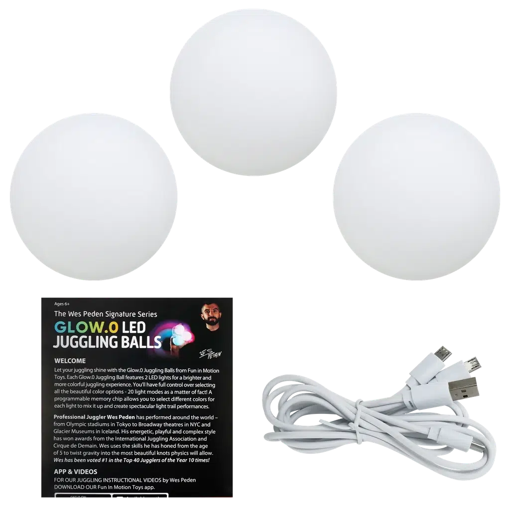 this image shows the 3 balls and a charger. the balls are white, but will glow different colors