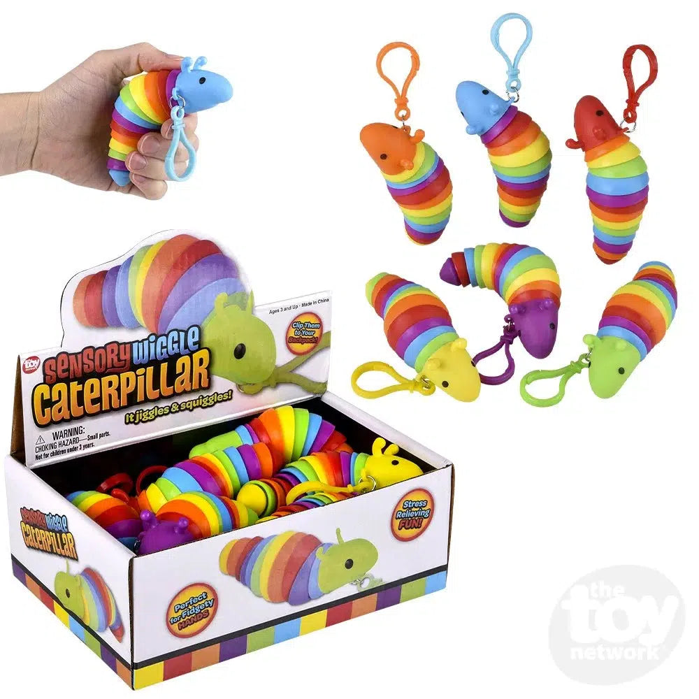 Image of an assortment of the sensory toys. Shows the in-store packaging they come in, an open top box.