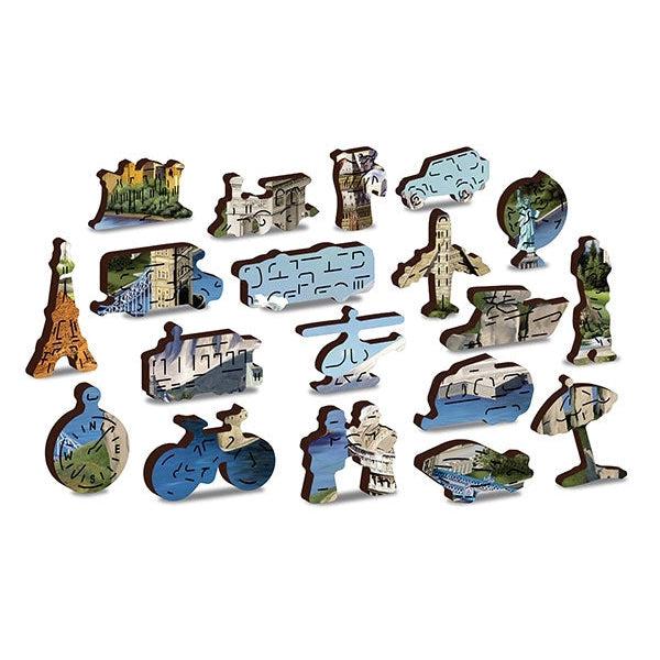 Examples of unique piece shapes pulled from puzzle | Example pieces shown depict shapes of landmarks, vehicles used in travel, a globe, and a compass.