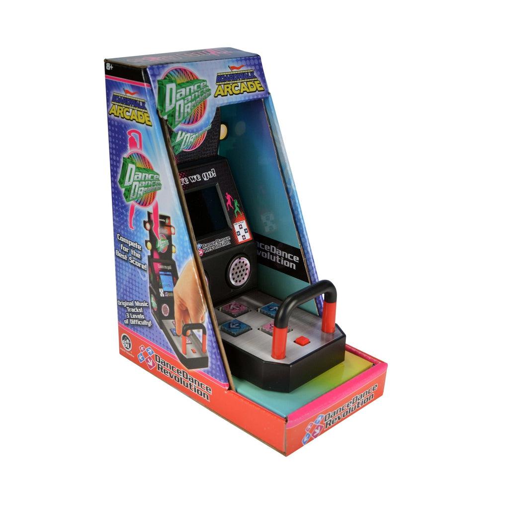 Image of the packaging. It comes in a arcade machine shaped box with it open so that you can see and touch the DDR machine.